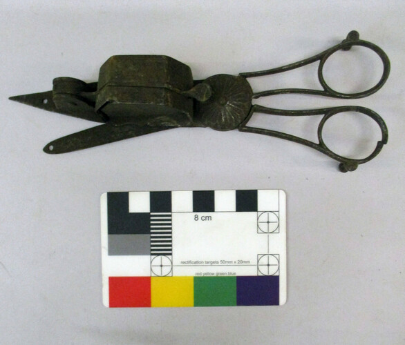 Scissor candle snuffers. Oval finger holes. The finger blades or arms